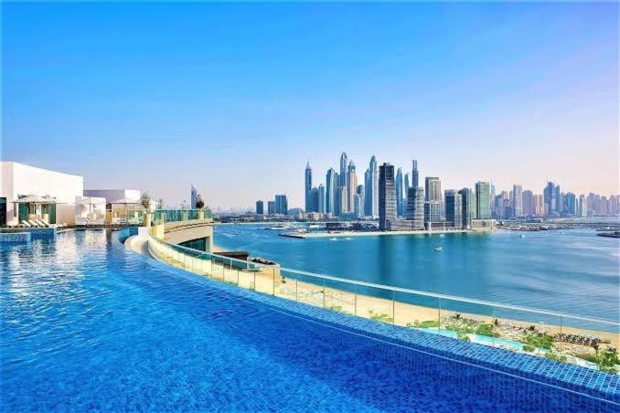 Modern 1BR Seven Palm Private Beach Infinity Pool