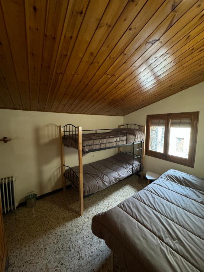 Cama o camas de una habitación en L Esquella Restaurante hostal