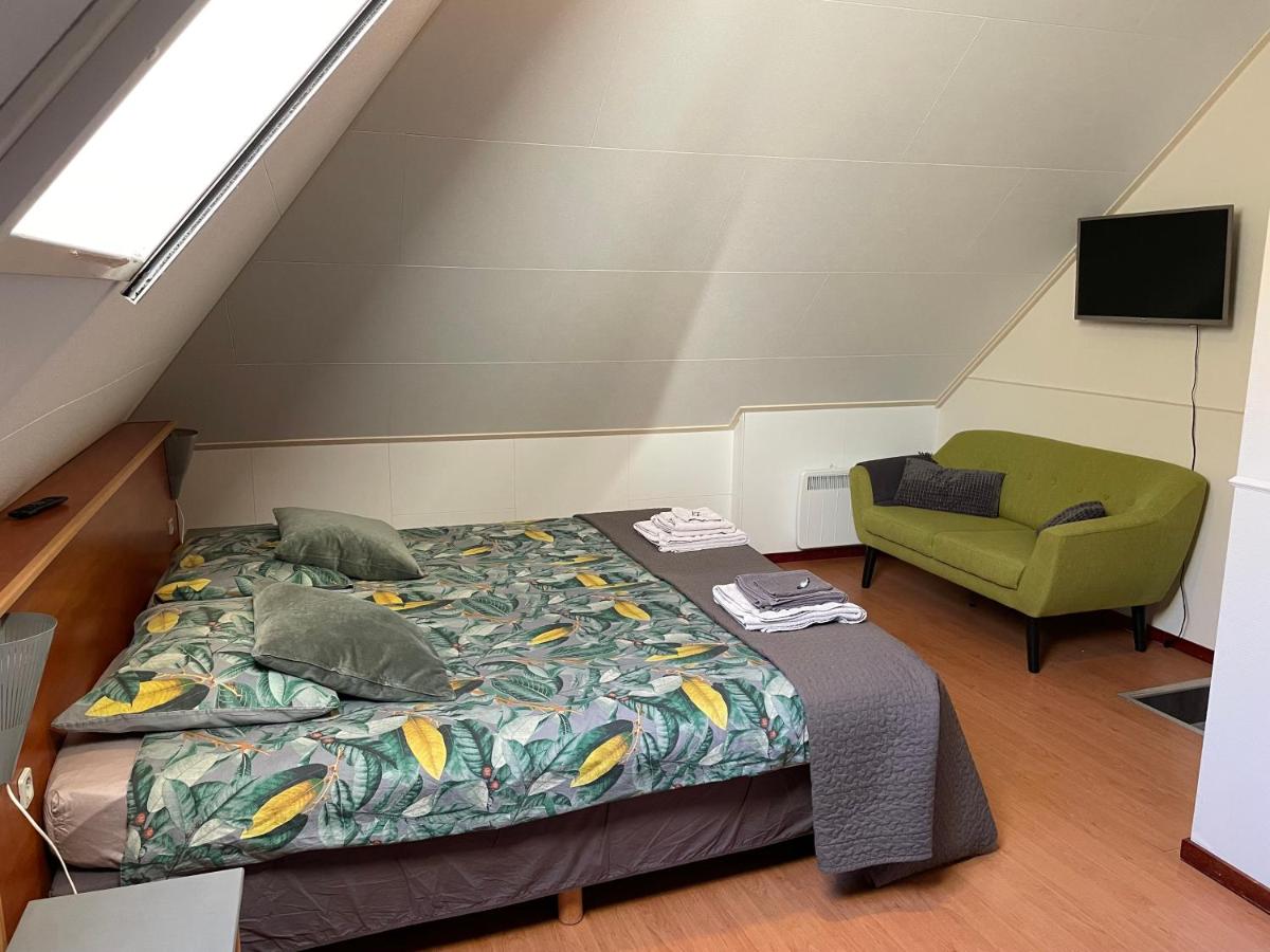 Een bed of bedden in een kamer bij An de Esch
