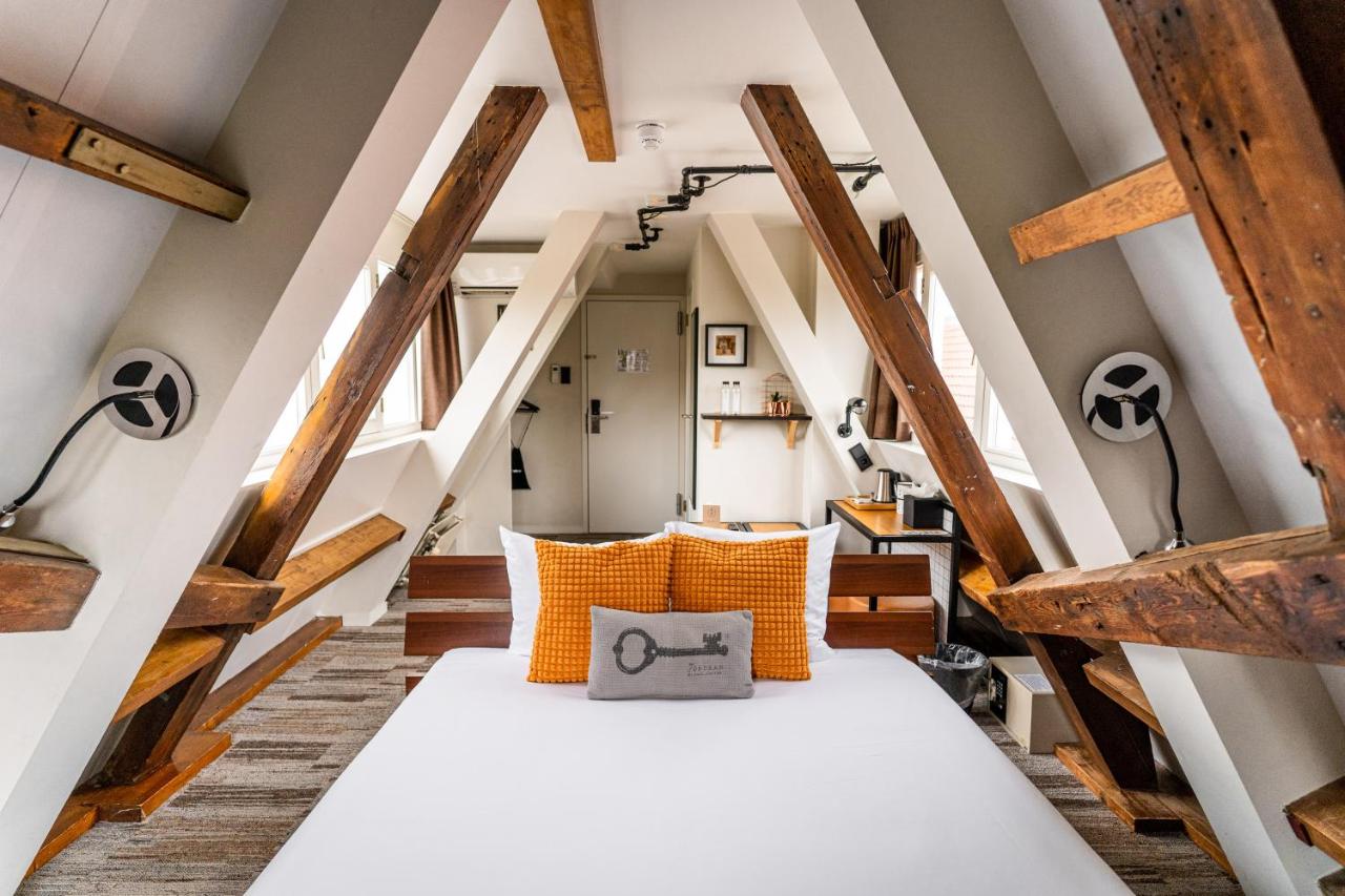 Een bed of bedden in een kamer bij Mr. Jordaan