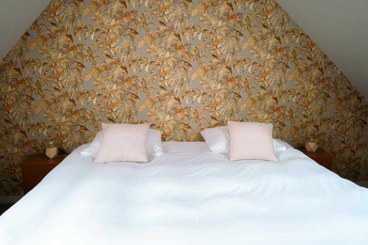 Een bed of bedden in een kamer bij Het Smaakhuis