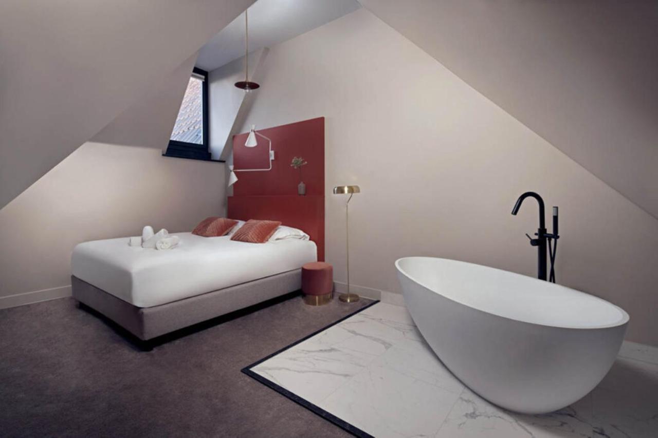 Een bed of bedden in een kamer bij The Anthony