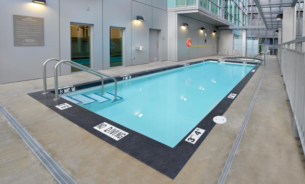 Heated swimming pool: Coast Coal Harbour Vancouver Hotel by APA