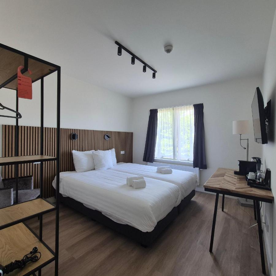 Een bed of bedden in een kamer bij Hotel Den Burg