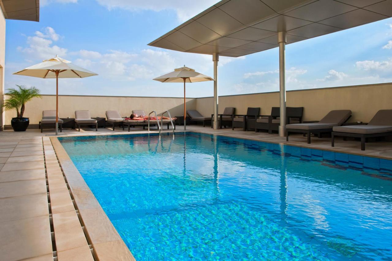 Rooftop swimming pool: Centro Al Manhal by Rotana