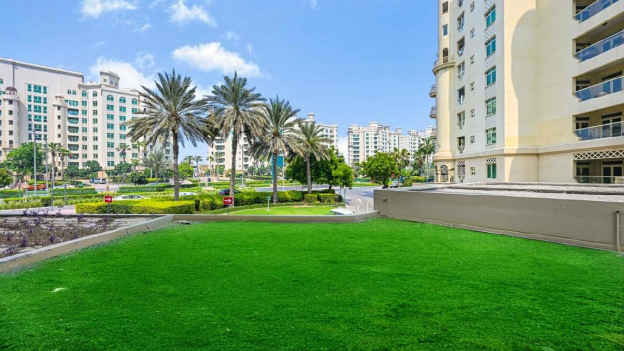 Palm Shoreline Elegance with Gym, Pool & Beach Access - 5