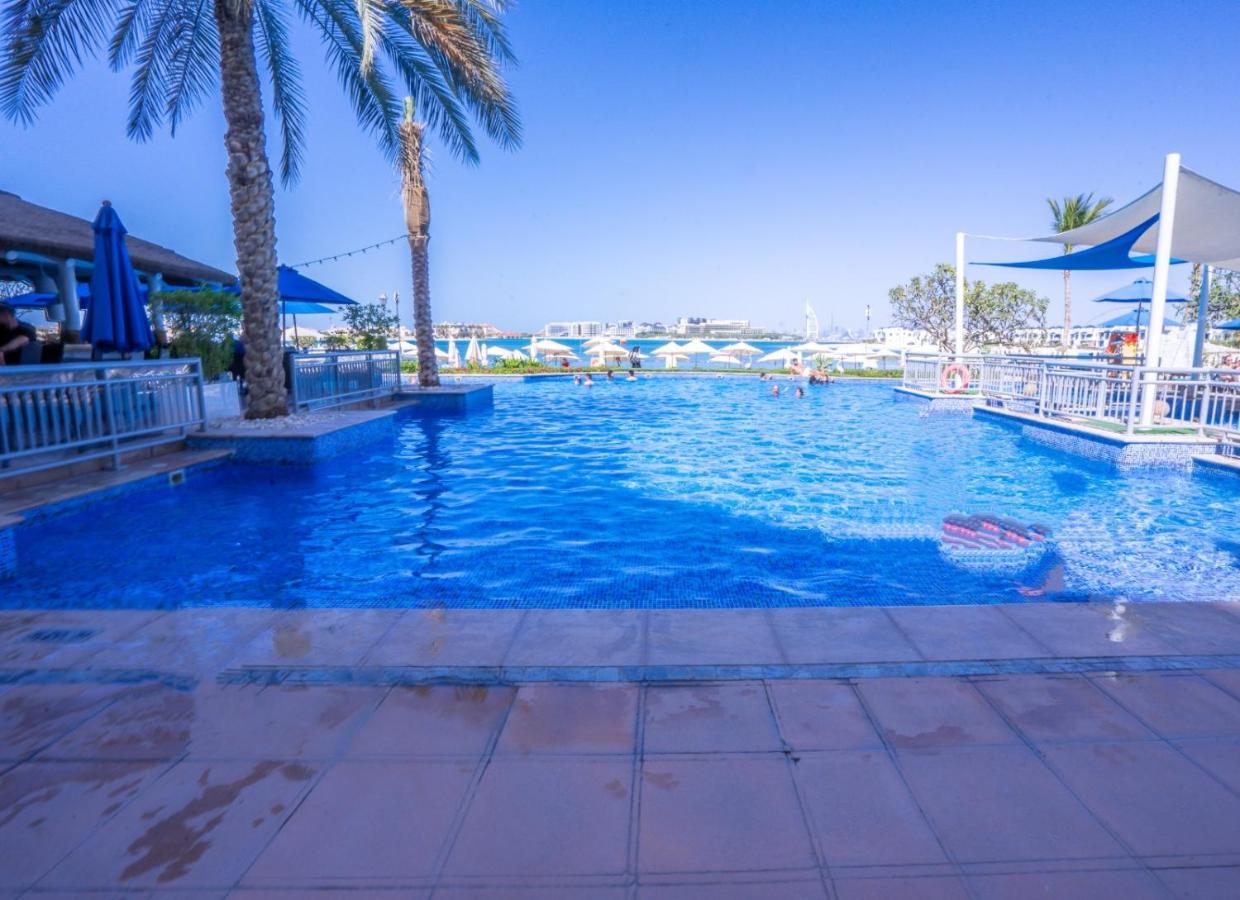 Palm Shoreline Elegance with Gym, Pool & Beach Access - 2