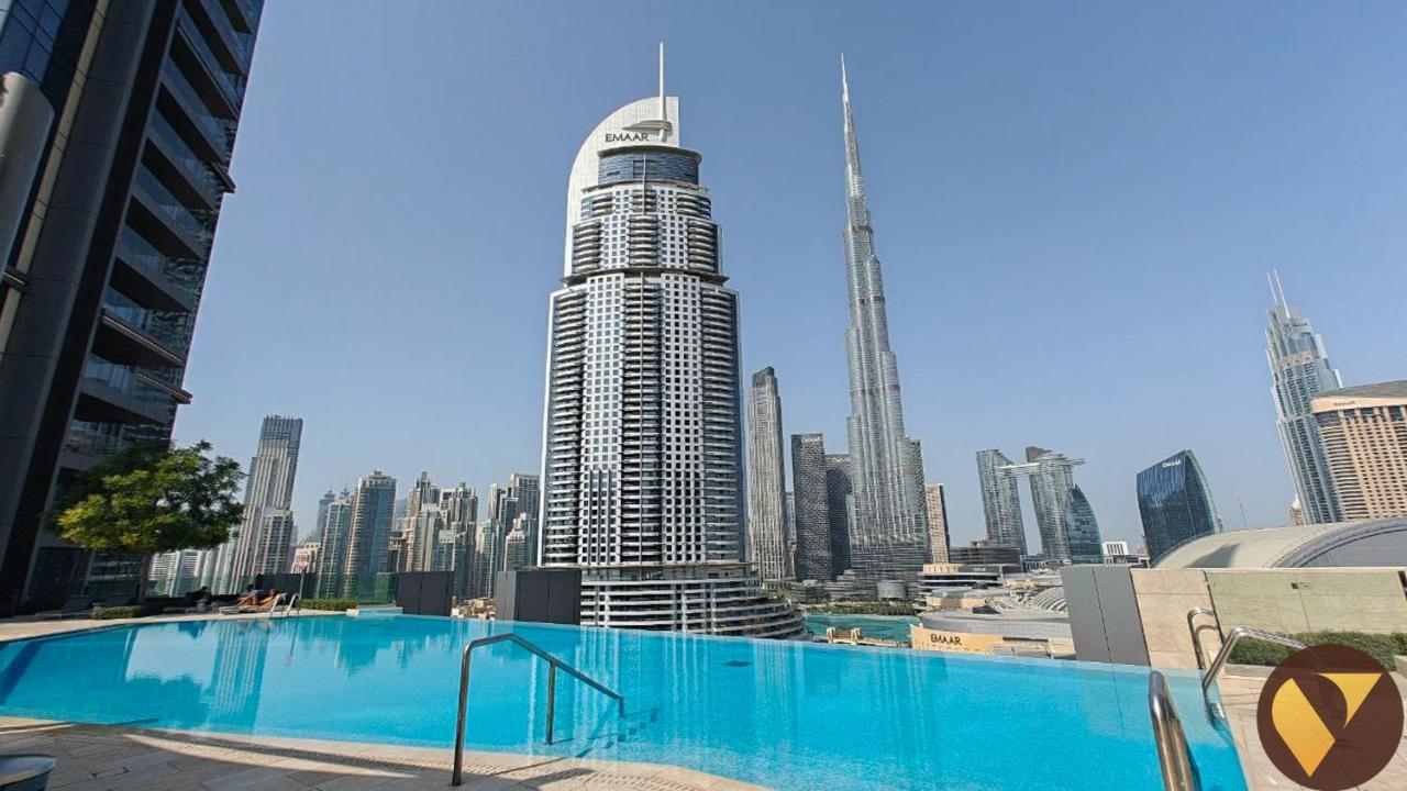 Vogue Vacation Homes, Downtown Boulevard Point near Burj Khalifa and Dubai Mall, One Bedroom Apartment with Burj Khalifa view from the Balcony and Access to all Amenities