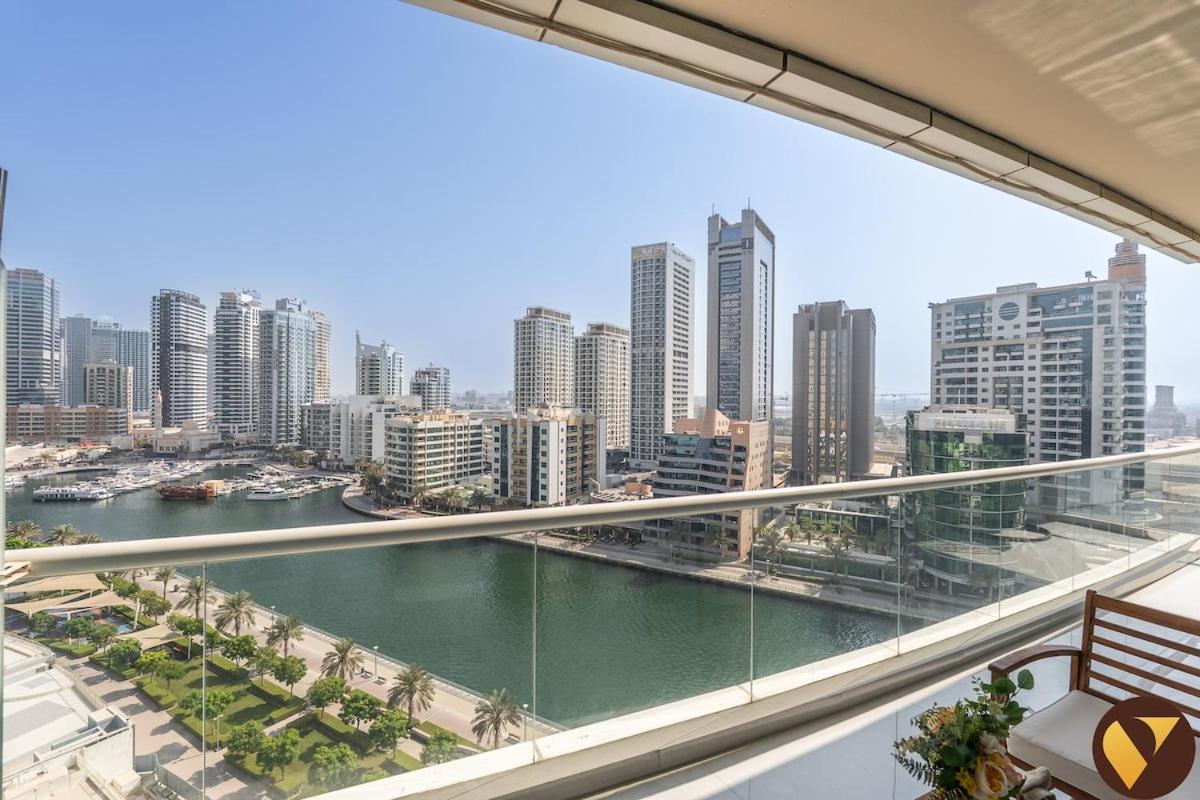 Vogue Vacation Homes, Marina Dorra Bay near JBR Beach and Ain Dubai, Two Bedroom apartment with Balcony, Canal and Skyline View, Access to all Amenities