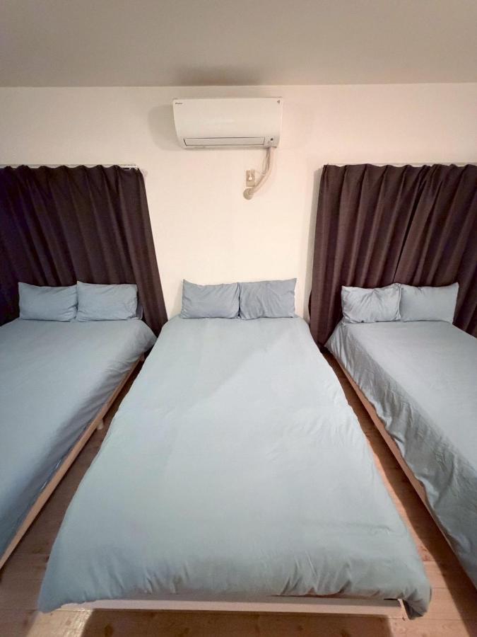 Wide bright room with three beds!