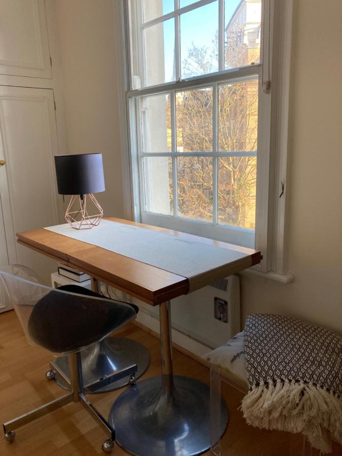 Luxurious tranquil large bedroom and bathroom suite with rooftop views in interior designed Georgian Townhouse - 2