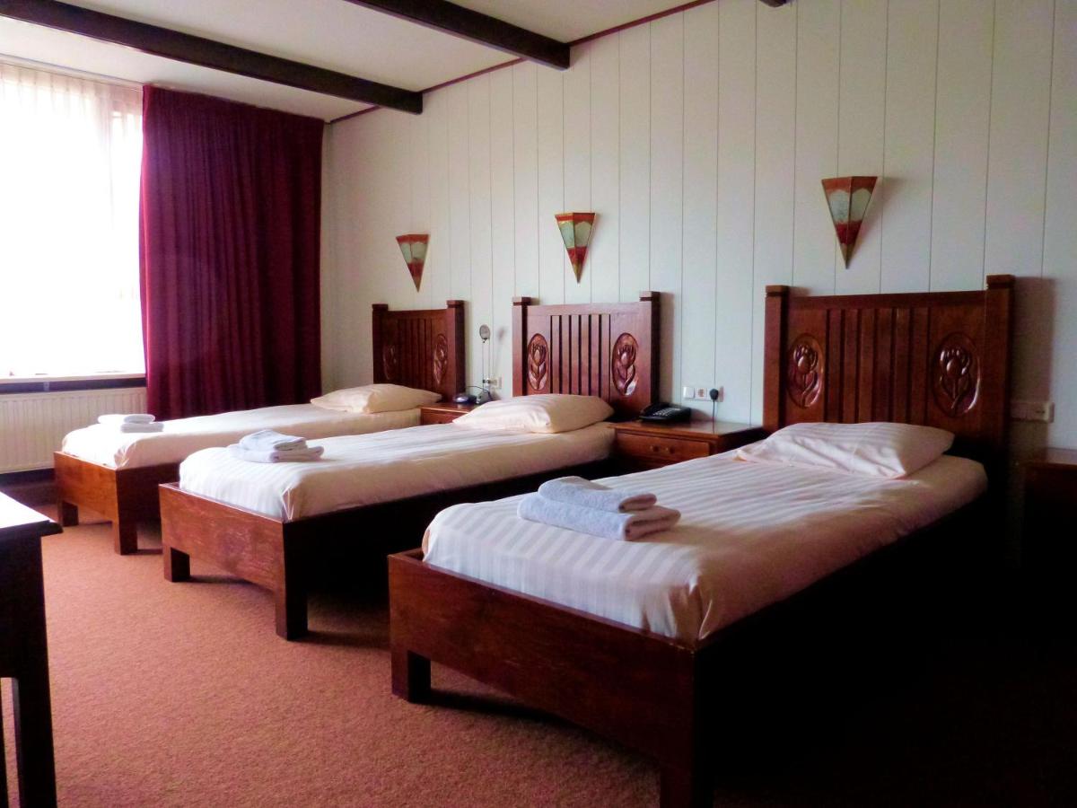 Een bed of bedden in een kamer bij Hotel Wienerhof