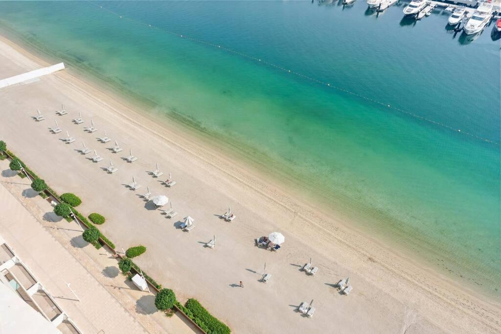 Vogue Vacation Homes, Emaar Beach Front Marina Vista near JBR and Palm Jumeirah, Two Bedroom Apartment with Balcony and Private Beach, Access to all Amenities - 3