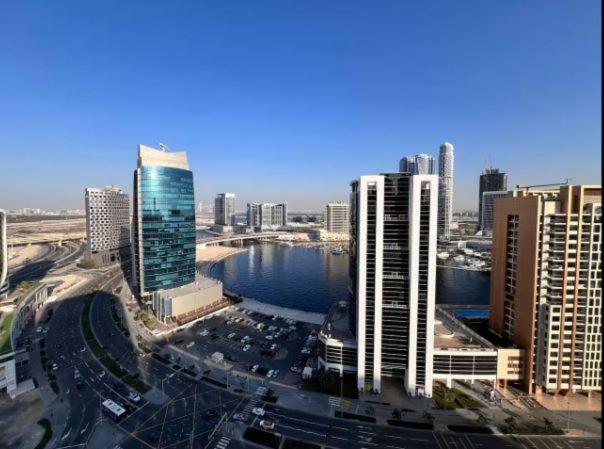 Vogue Vacation Homes, Downtown Mag 318 near Burj Khalifa and Dubai Mall, Studio Apartment with Balcony, Canal and City View, Access to all Amenities - 5