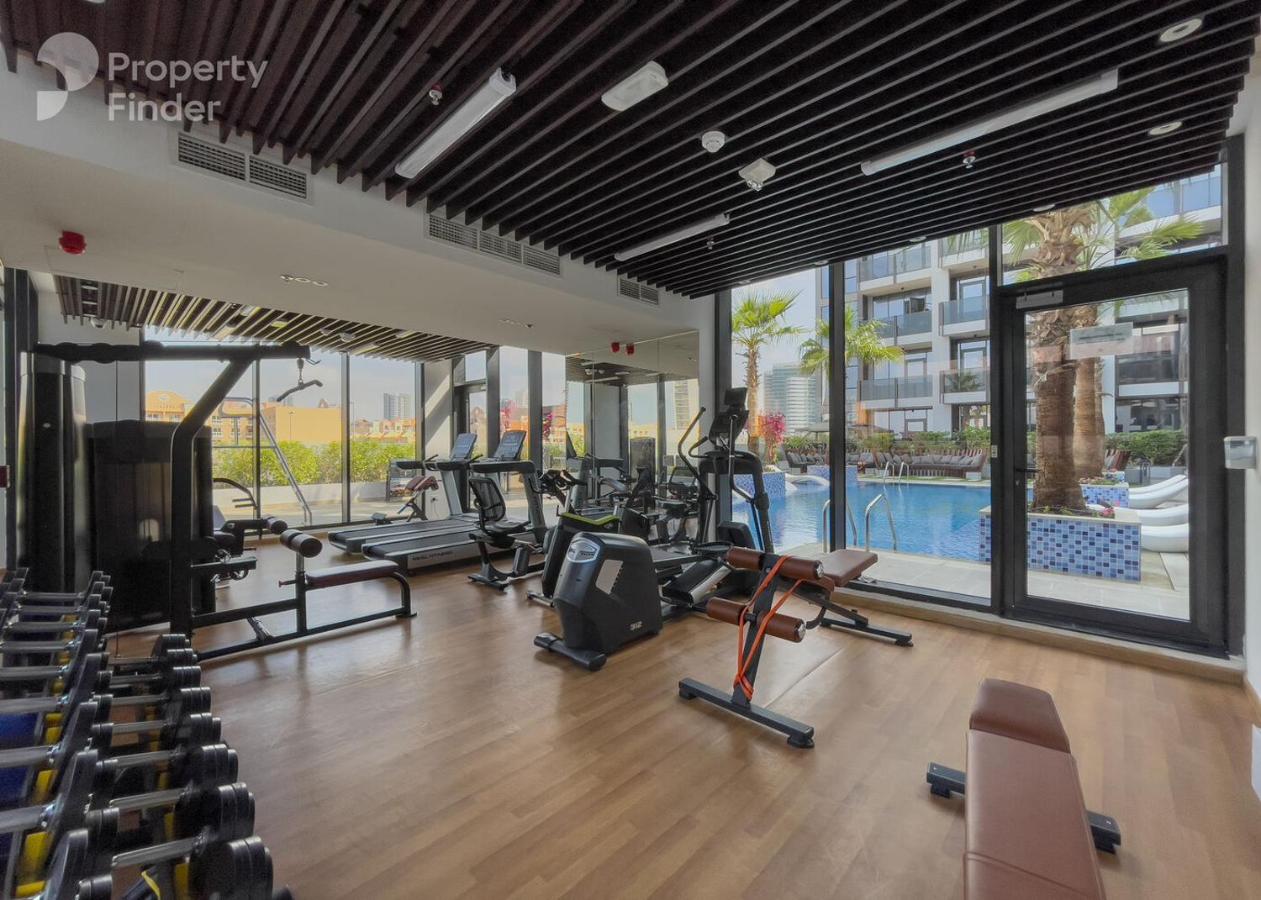 Vogue Vacation Homes, JVC Chaimaa Avenue near Circle Mall, One Bedroom Apartment with Balcony and City View, Access to all Amenities - 5