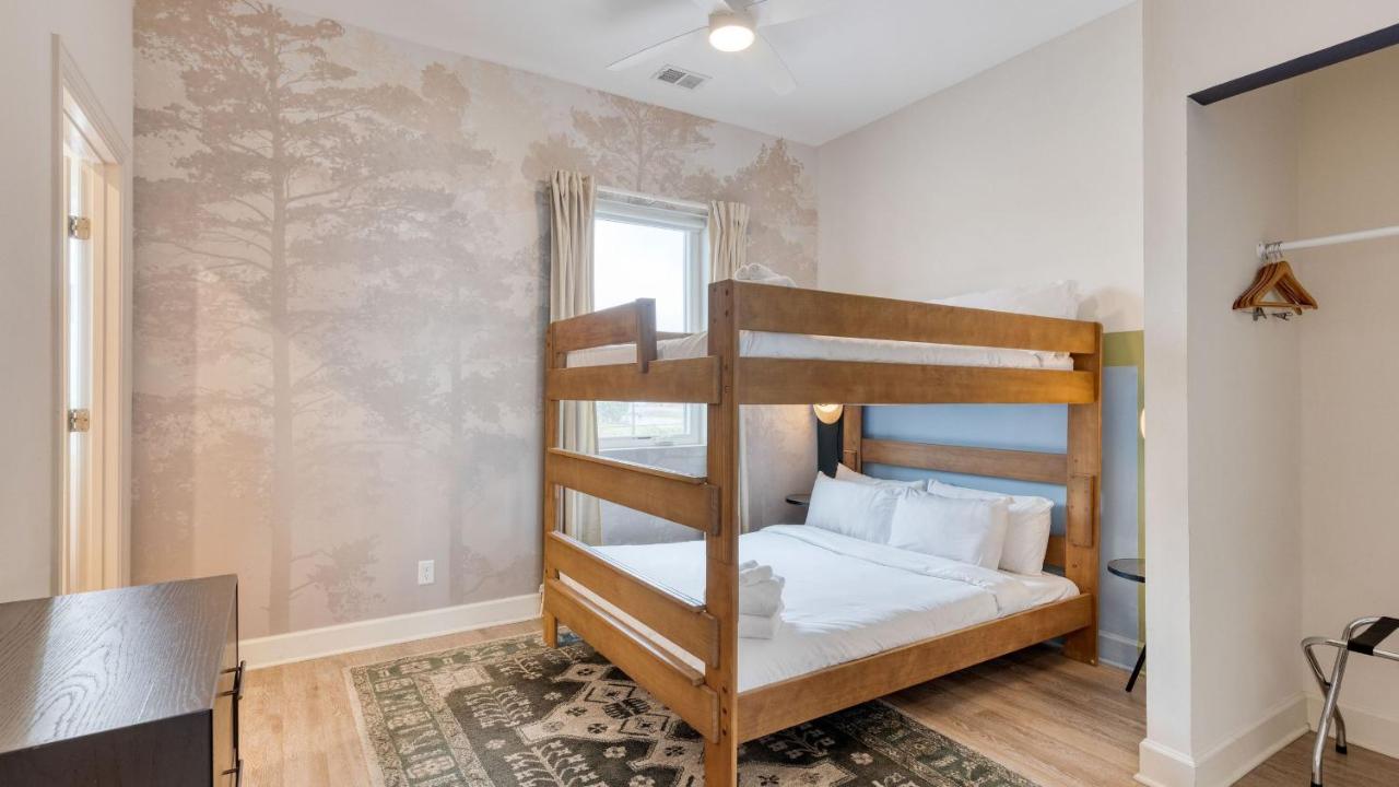 Sleeps 44 4 themed lofts w skyline balconies neon backdrops glam kitchens—perfect for Nashville group stays The Swift Retreat by AvantStay - 2