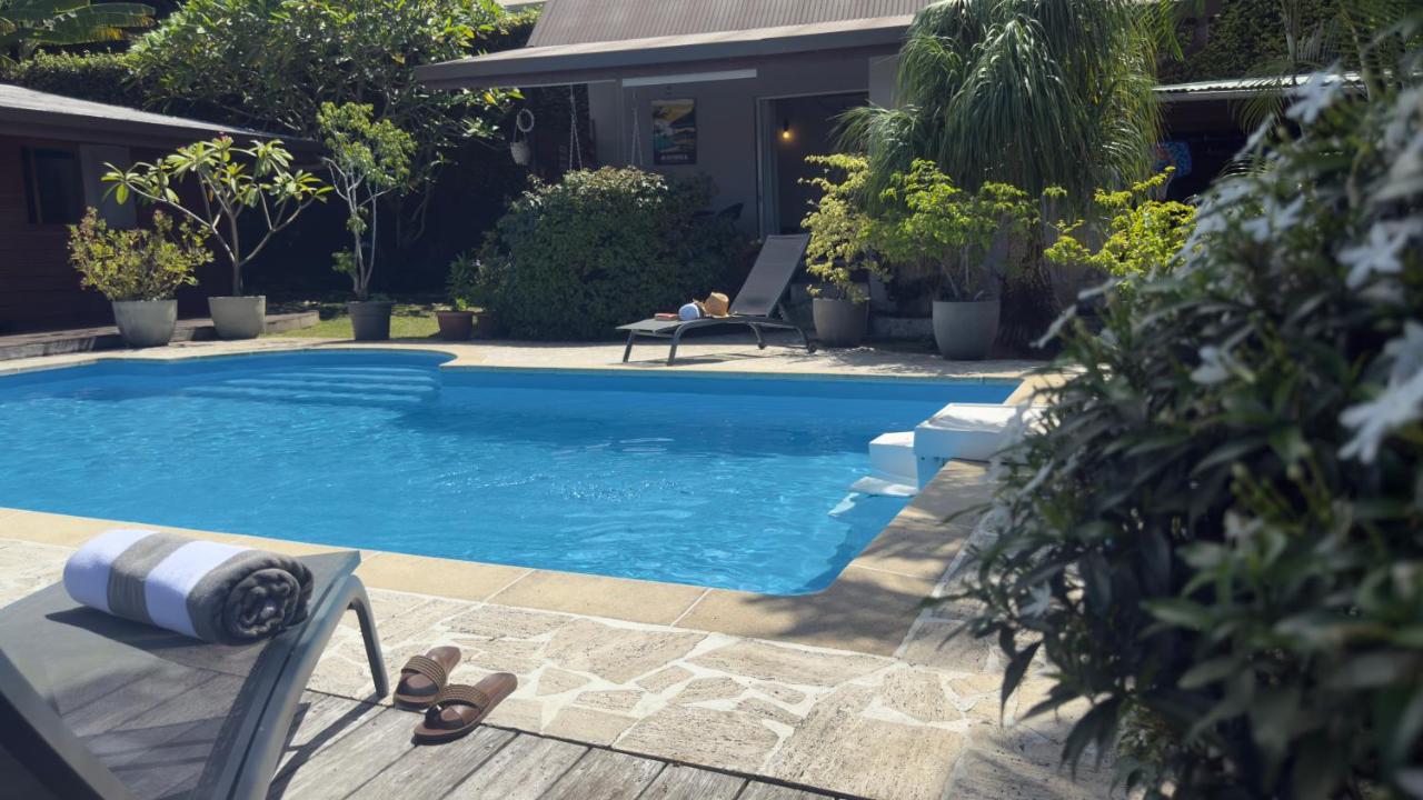 Séjour tropical à Paea - bungalow tout confort avec piscine, climatisation
