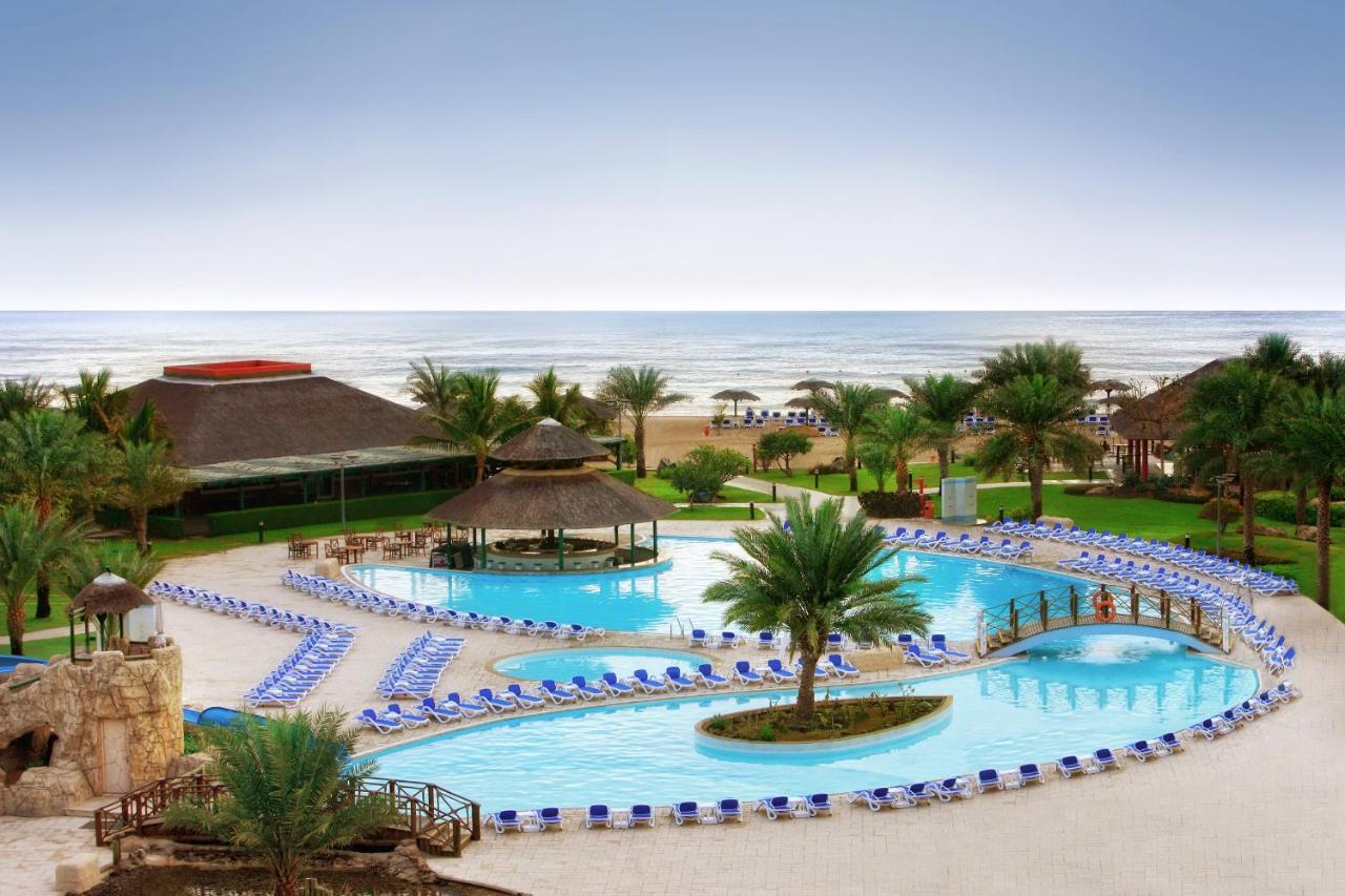 Heated swimming pool: Fujairah Rotana Resort & Spa - Al Aqah Beach