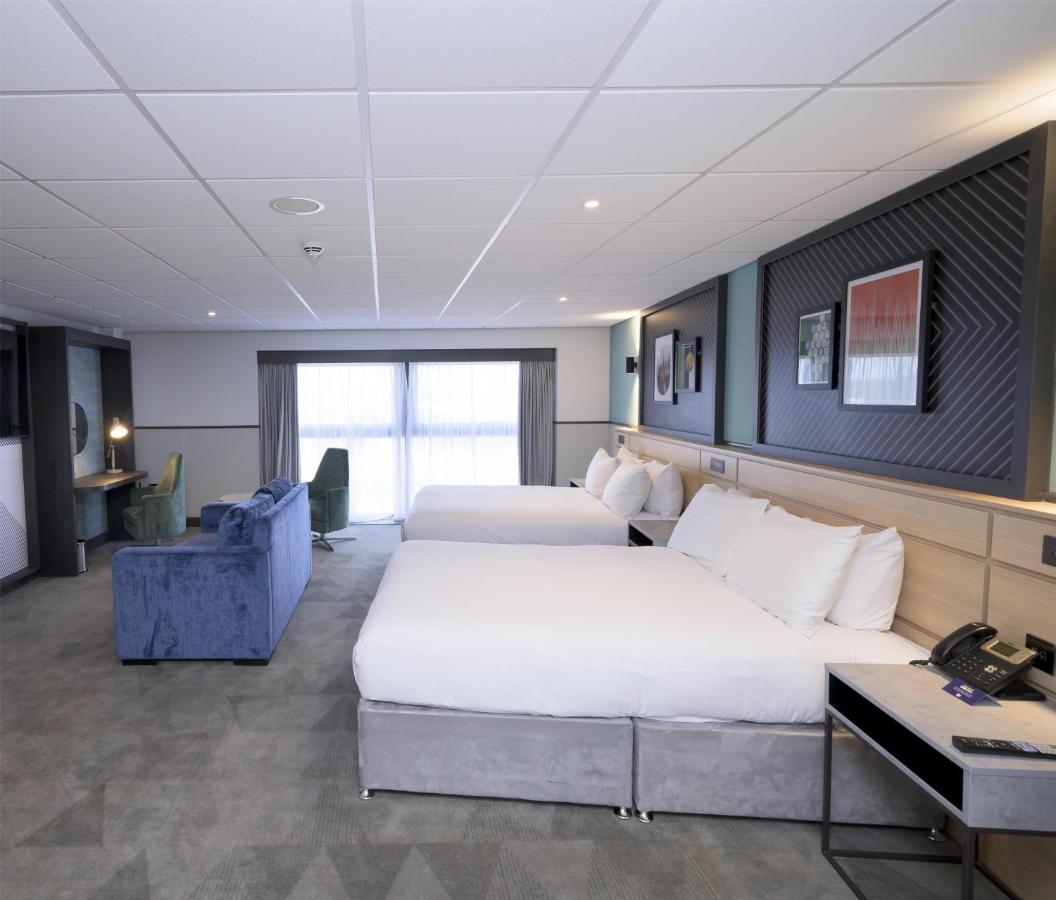 Family Queen Room with Two Queen Beds and Sofa Bed