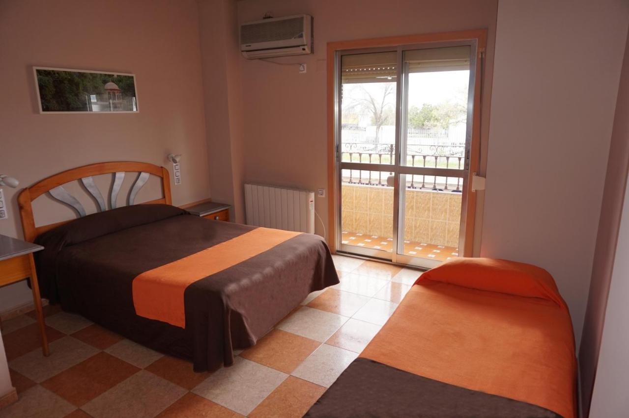 Cama o camas de una habitación en Hostal Alamare