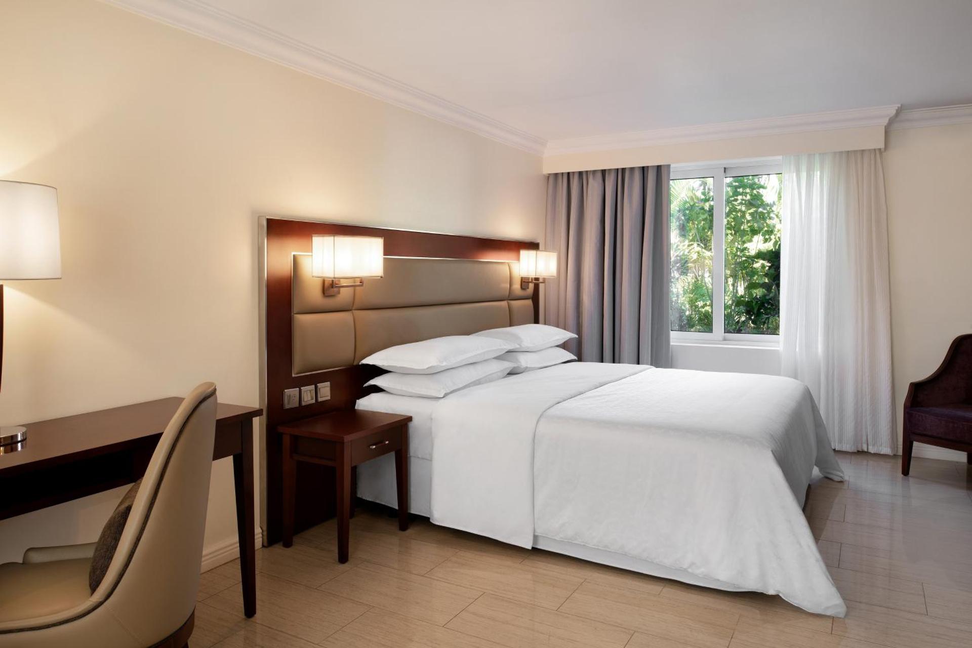 Two-Bedroom Family Room with One King Bed and Two Double Beds