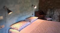 A bed or beds in a room at Agriturismo Spizzirò