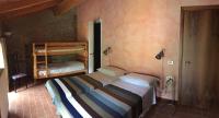 A bed or beds in a room at Agriturismo Spizzirò