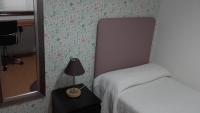 A bed or beds in a room at PR La Paz