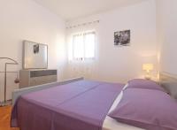 Łóżko lub łóżka w pokoju w obiekcie Apartments Mira 1293