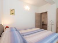 Łóżko lub łóżka w pokoju w obiekcie Apartments Mira 1293