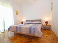 Łóżko lub łóżka w pokoju w obiekcie Apartments Mira 1293