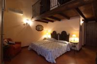 A bed or beds in a room at Agriturismo La Cascinetta
