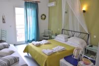 Postel nebo postele na pokoji v ubytování Eros Beach Hotel