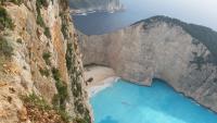 an aerial view of a beach in a mountain cliff at Pansion Porto Tsi Ostrias in Keri