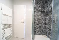 a shower with a glass door in a bathroom at Villa Gradski Vrt in Osijek