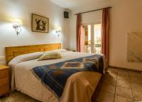A bed or beds in a room at Casa Charlotte
