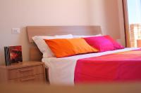 A bed or beds in a room at Dimora Rosso Piceno