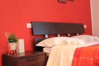 A bed or beds in a room at Dimora Rosso Piceno