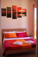 A bed or beds in a room at Dimora Rosso Piceno