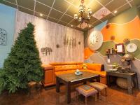 a living room with a couch and a christmas tree at Kimoge Homestay in Hualien City