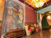a room with a mural of a bear on the wall at Kimoge Homestay in Hualien City