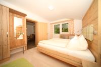 A bed or beds in a room at Pension Sonnwendhof