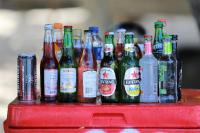 a group of bottles of beer on a red table at Seahouse Bali Indah Beach Inn in Kuta