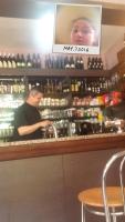 a man standing behind the counter of a store at Restaurant &amp; rooms Visovac - best value in Skradin