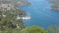 a bunch of boats are docked in the water at Restaurant &amp; rooms Visovac - best value in Skradin