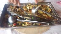 a tray of food with a fish and vegetables at Restaurant &amp; rooms Visovac - best value in Skradin