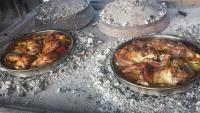 two pans of chickens are cooking in an oven at Restaurant &amp; rooms Visovac - best value in Skradin