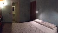 A bed or beds in a room at Agriturismo Spizzirò