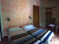 A bed or beds in a room at Agriturismo Spizzirò