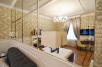 Televízia a/alebo spoločenská miestnosť v ubytovaní Duomo Rooms